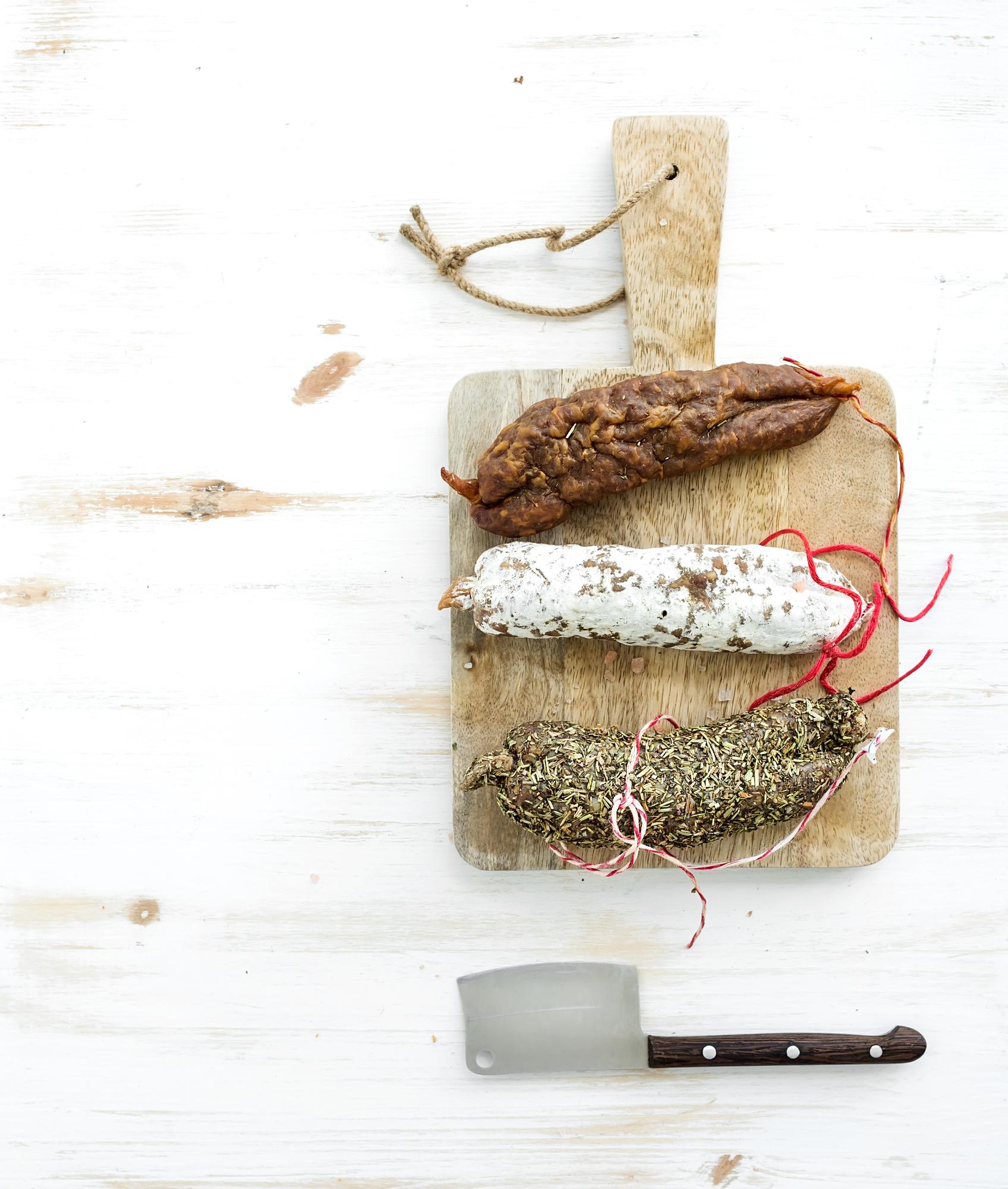 wooden board with artisanal bread and herbs